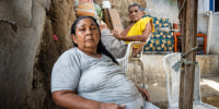 Carmela Medina and Alejandro Carranza, parents of Alejandro Carranza, a Colombian man who allegedly died when the U.S. bombed a boat supposedly carrying drugs in the Caribbean, pose for a photo at their house in Santa Marta on October 21, 2025.