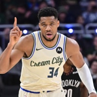 Nov 29, 2025; Milwaukee, Wisconsin, USA; Milwaukee Bucks forward Giannis Antetokounmpo (34) reacts after scoring his 21,000th career point in the third quarter against the Brooklyn Nets at Fiserv Forum. Mandatory Credit: Benny Sieu-Imagn Images