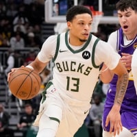 Nov 15, 2025; Milwaukee, Wisconsin, USA;  Milwaukee Bucks guard Ryan Rollins (13) drives towards the basket during the first quarter against the Los Angeles Lakers at Fiserv Forum. Mandatory Credit: Jeff Hanisch-Imagn Images